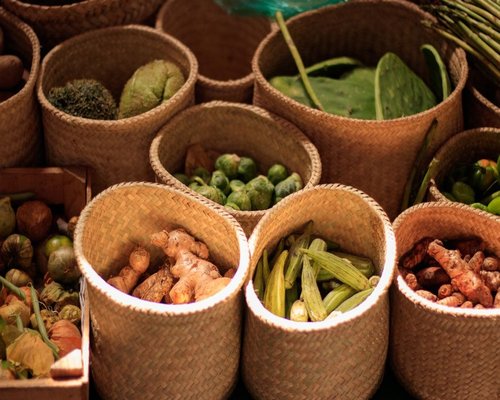 Detail view of woven baskets containing local produce