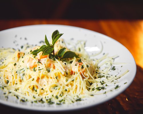 A relaxed domestic lunch scene showing diverse and colorful local plates